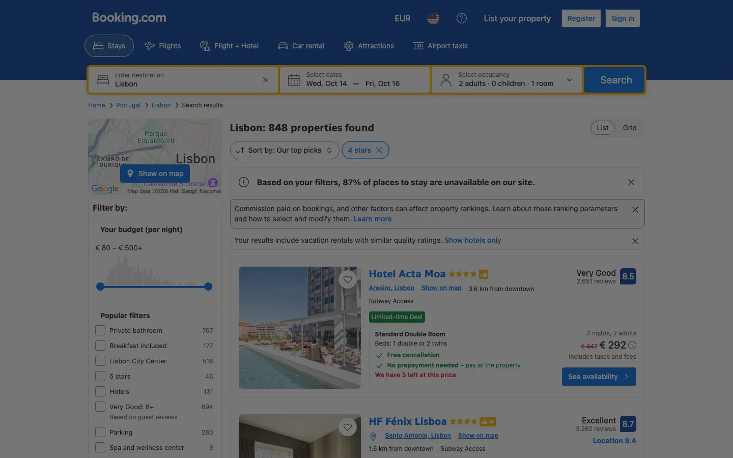 Booking.com search results for Lisbon, 14 to 16 October 2026: prices per two-night stay with a struck-through original rate, a limited-time deal badge, and the notice that commission paid affects property rankings
