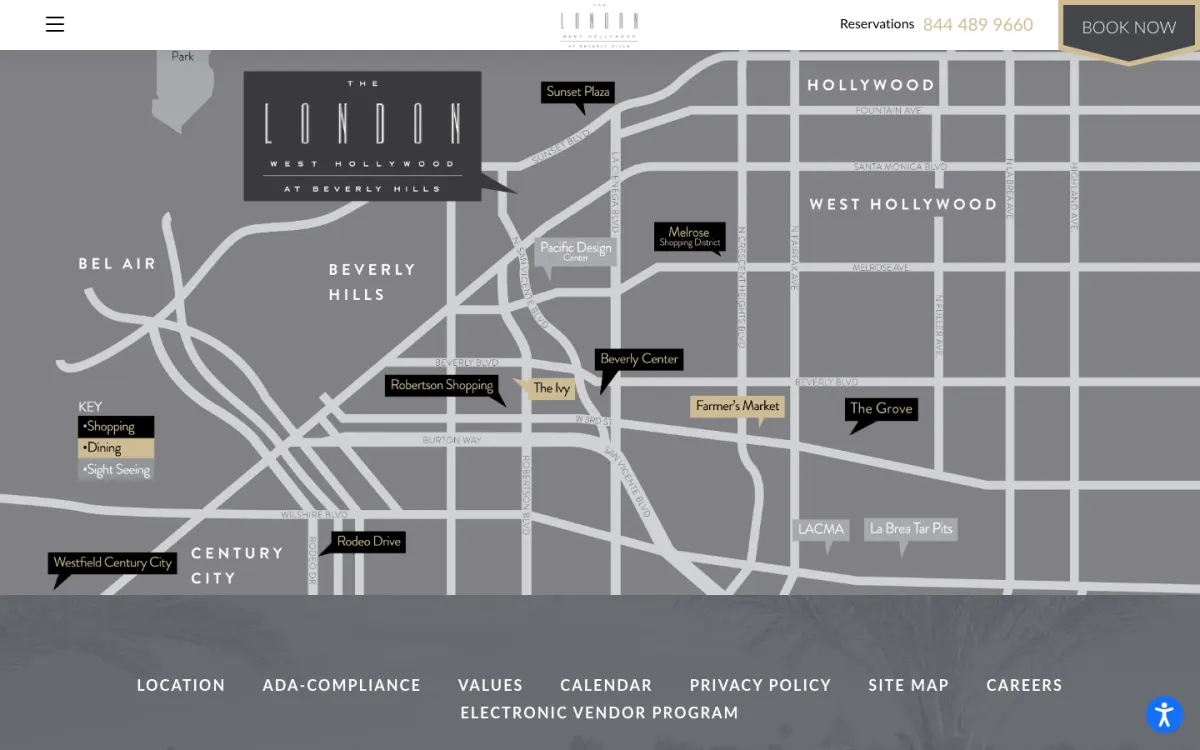 The live neighborhood map on 9 October 2026: the same street layout and logo callout as the 2018 design, recoloured grey, with landmark labels for Sunset Plaza, Pacific Design Center, the Beverly Center, the Grove and Rodeo Drive and a key for shopping, dining and sightseeing